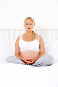 Pregnant Woman Meditating - Isolated