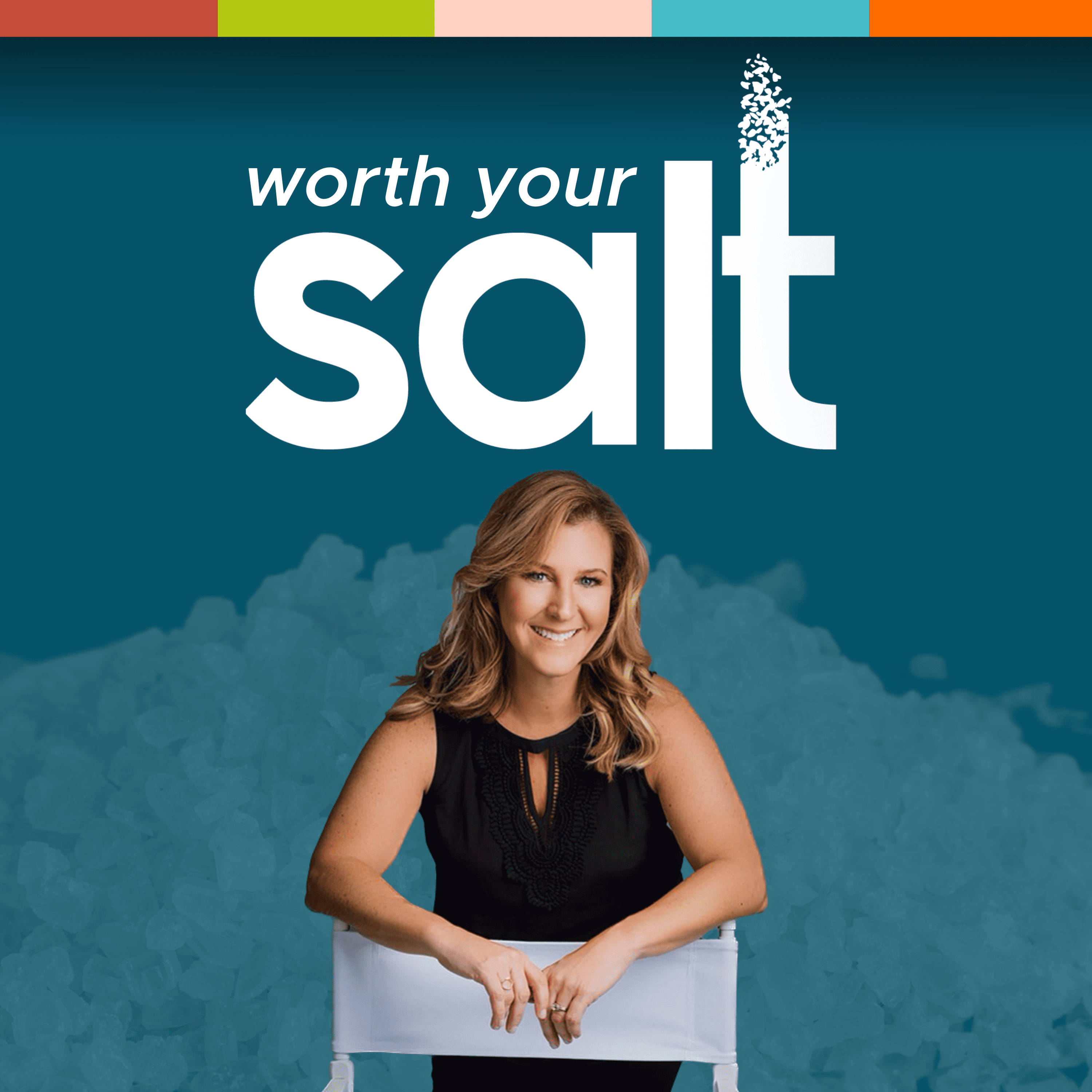 A slim woman in a black shirt is leaning over the back of a chair smiling at the camera. Above her head in large white letters it says Worth Your Salt. Her name is Jennifer.